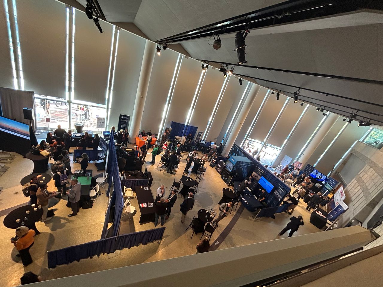 corporate event planner Miami trade show expo event with exhibition booths and attendees