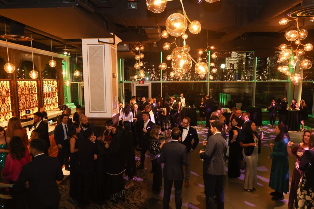 corporate event planner Miami gala corporate event with guests networking in luxury venue