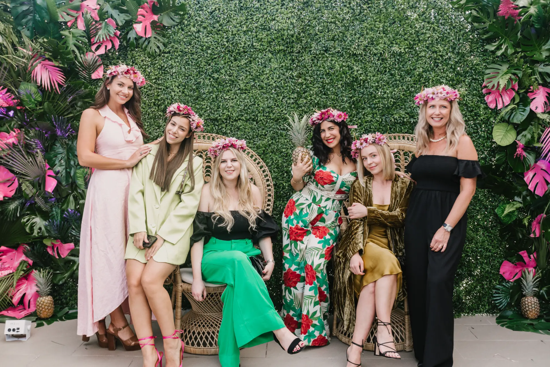 corporate event planner Miami themed corporate event with guests in floral decor setting