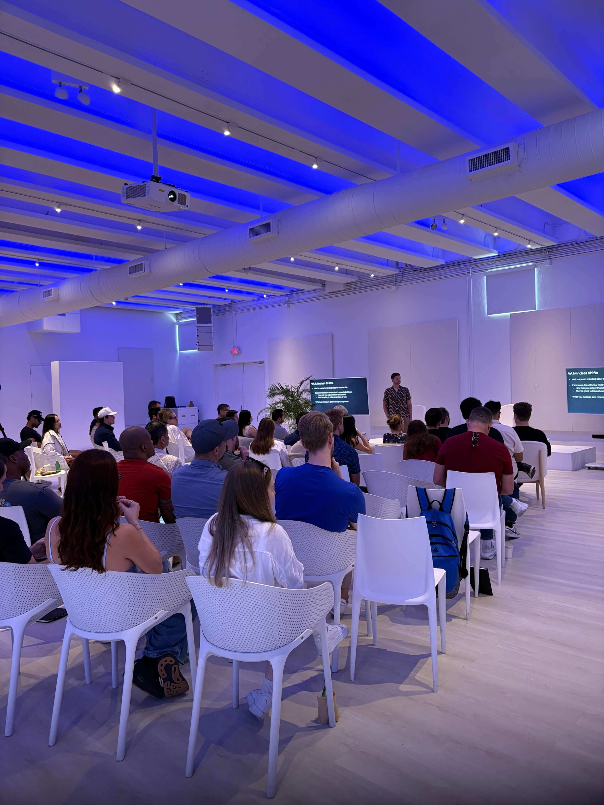 Corporate evening reception with blue lighting produced by Event More