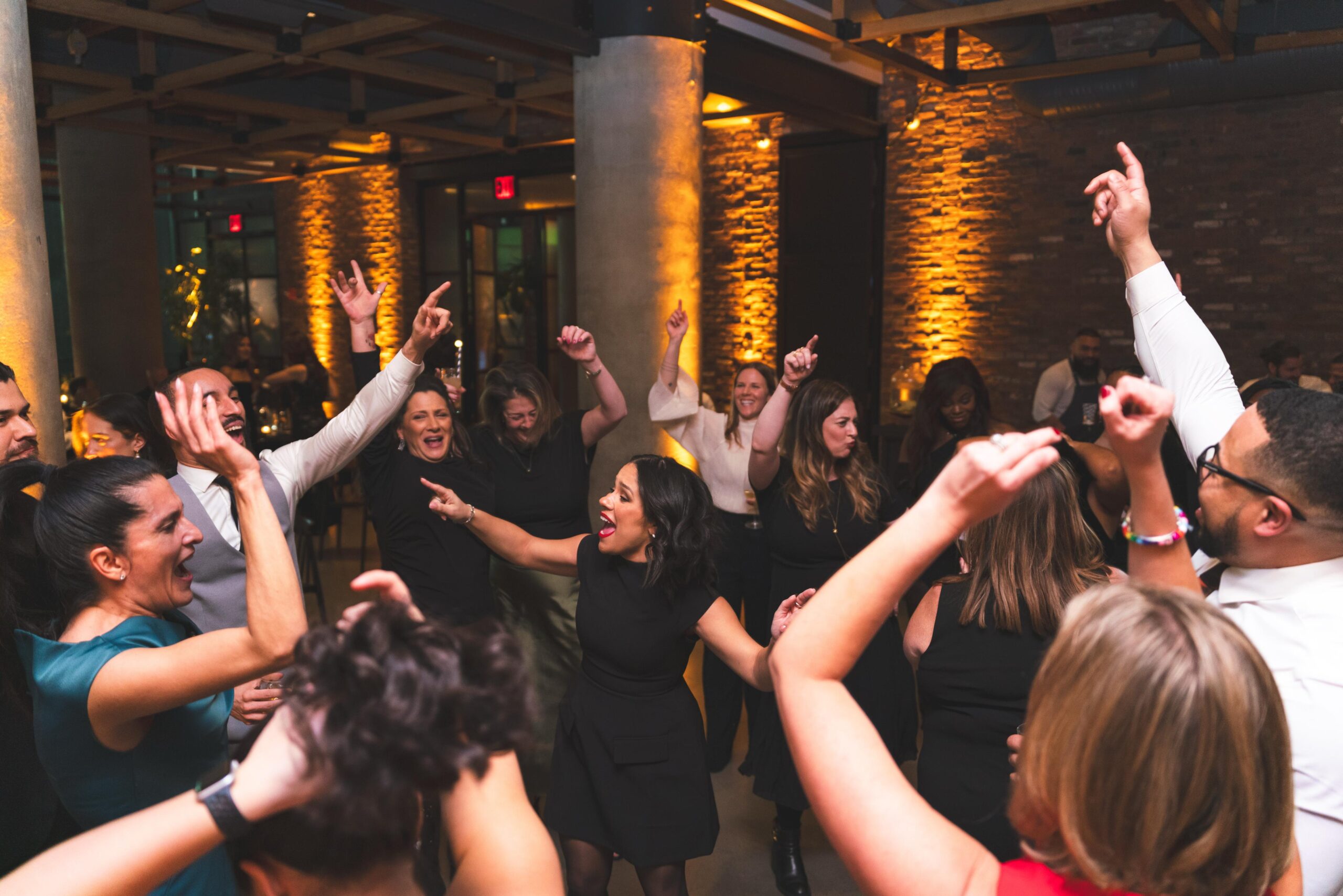 Guests dancing at a corporate holiday party planned by Event More in Miami